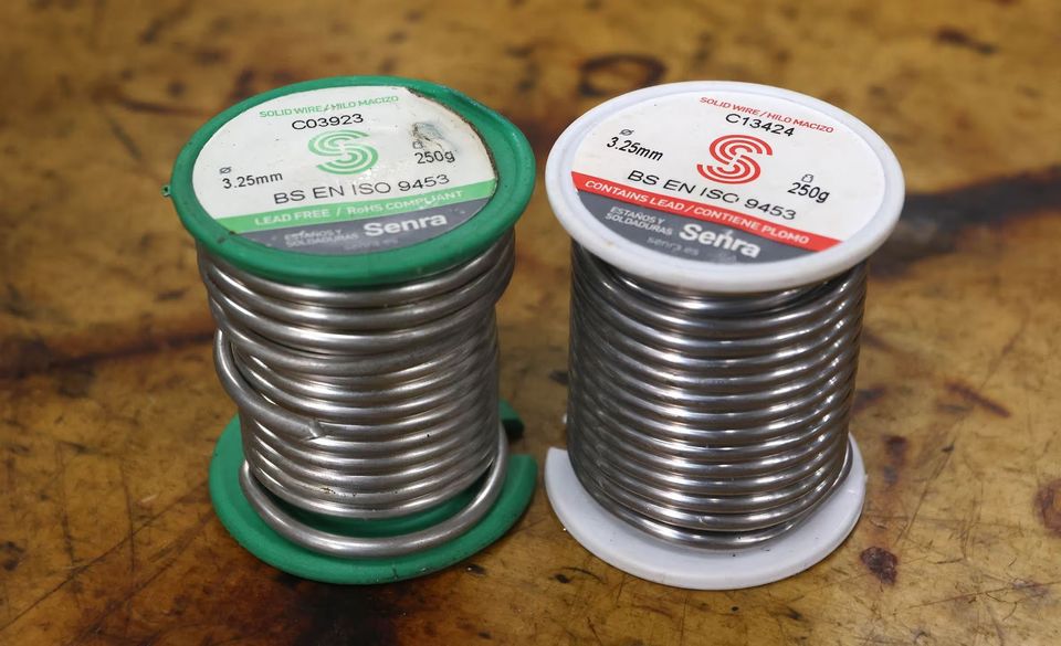 Two spools; the green one on the left is lead-free solder and the one on the right is lead solder